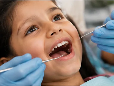 A child having a dental check-up in the chair